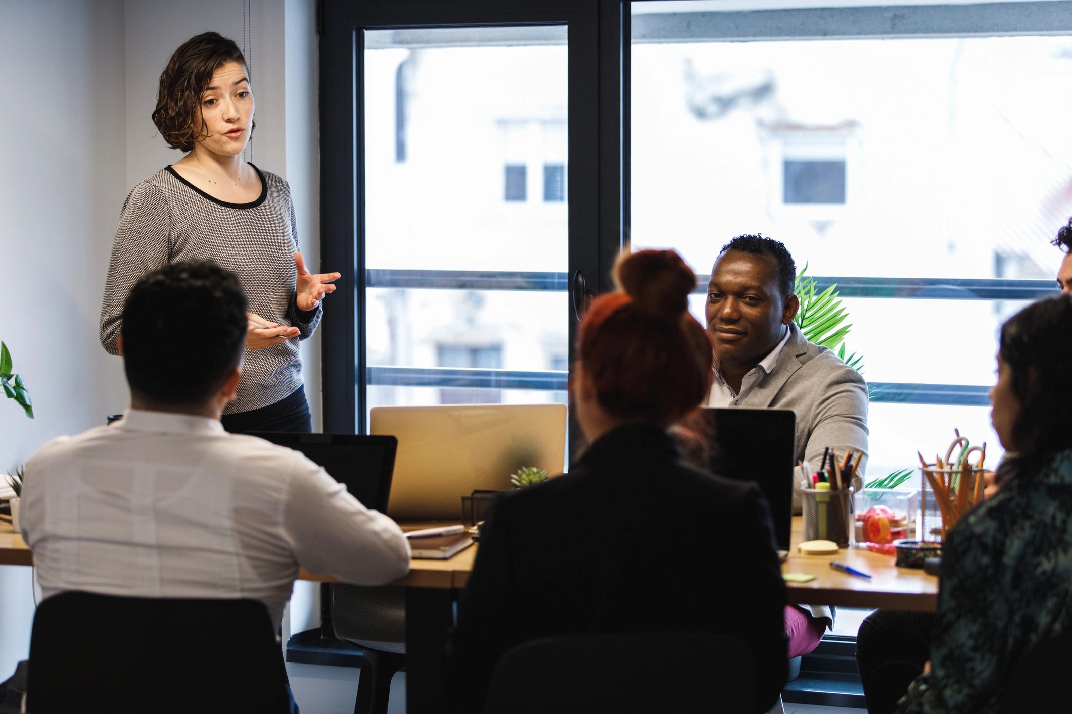 HR team presenting strategy in a boardroom