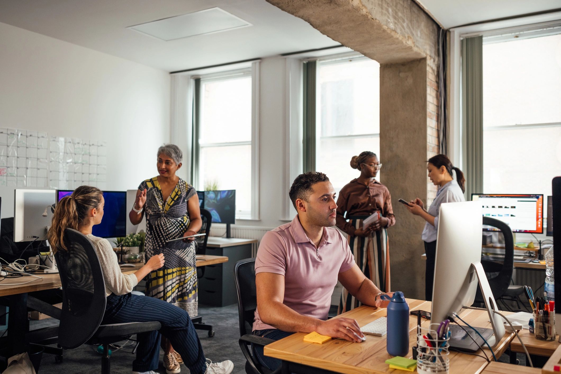 SupeHR team collaborating in a modern office
